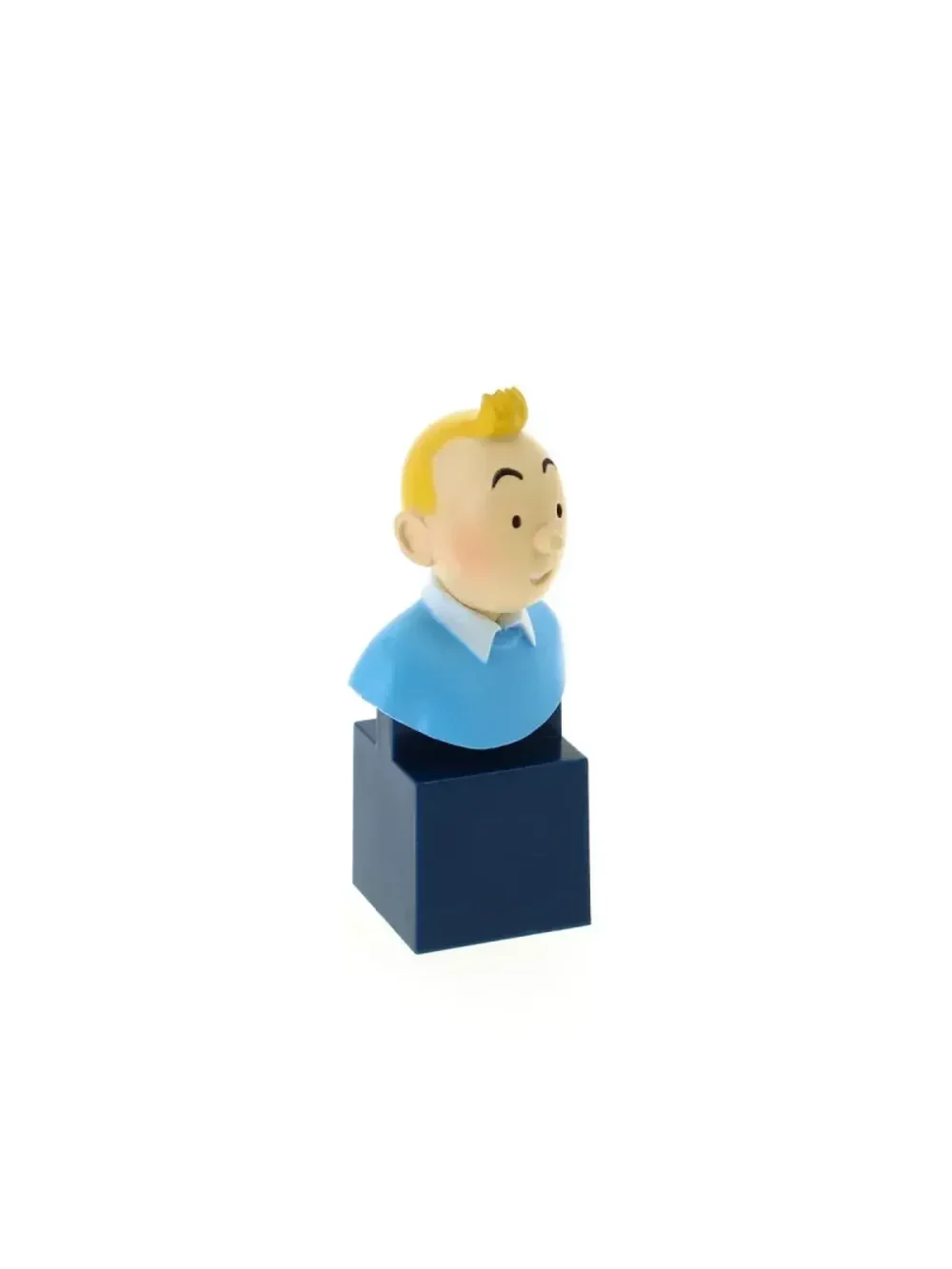 Petit buste de Tintin sur socle bleu. Collection de huit figurines en PVC d'une hauteur de 7,5cm. Ne convient pas aux enfants de moins de 7 ans.