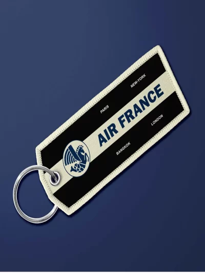 Porte-clé en tissu "flamme" Air France vintage noir. Très maniable, il se glisse partout et permet vite de retrouver ses clés.