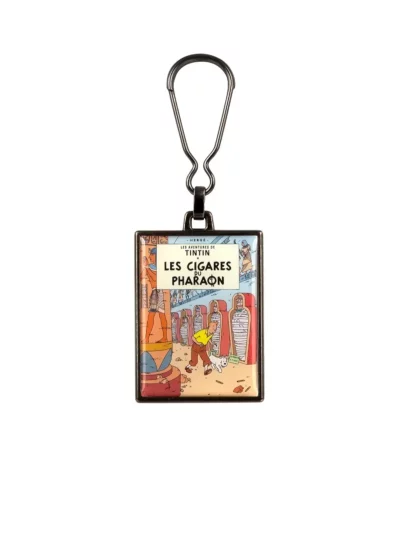 La couverture de l'album "Les cigares du Pharaon" en porte-clés métallique. Ce porte clés apportera une touche d’amusement et d’aventure à votre quotidien.