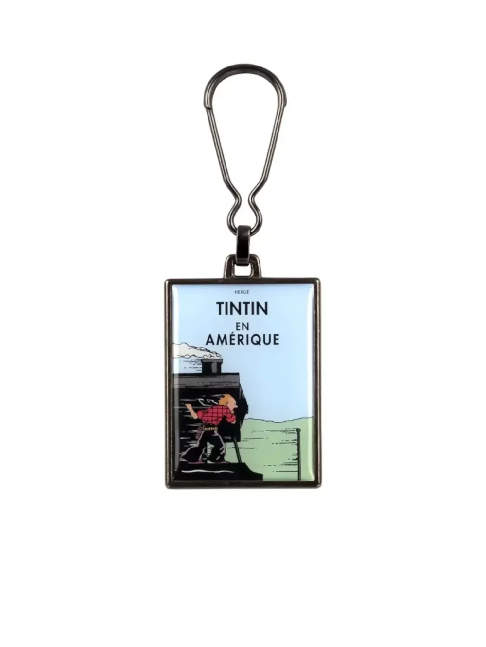 La couverture de l'album "Tintin en Amérique" en porte-clés métallique. Ce porte clés apportera une touche d’amusement et d’aventure à votre quotidien.